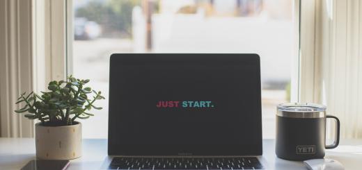 Photo of a laptop with 'just start' on the screen