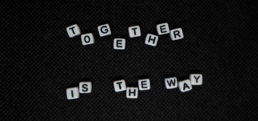 A black background with 'Together is the way' displayed with each letter being an individual white dice with black lettering